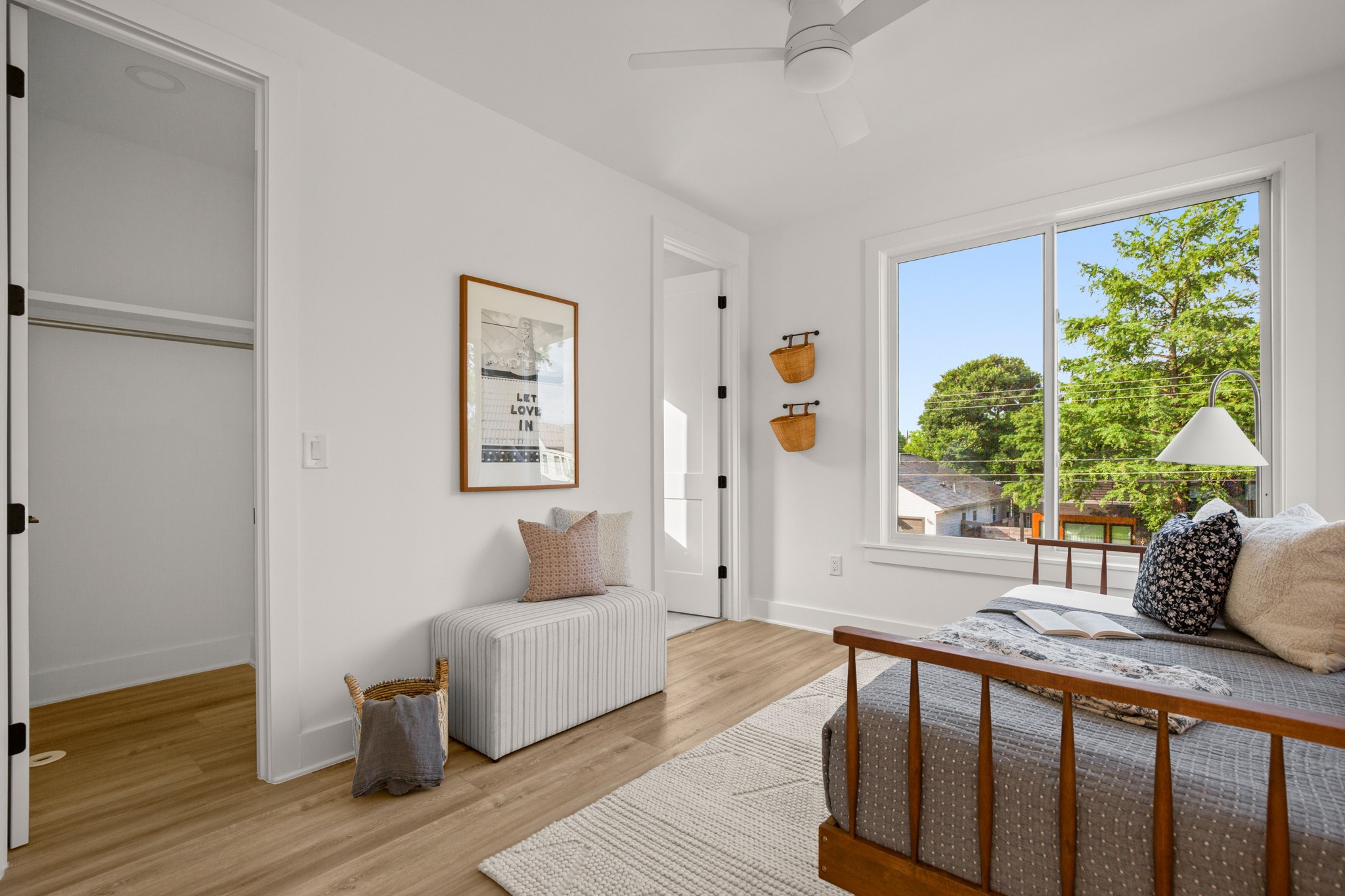 1912 Madison Avenue Austin, TX 78757 - Photo 9 of 17 Bedroom with ceiling fan and light wood finished floors