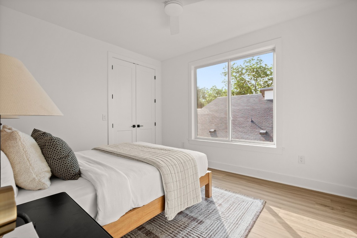 1912 Madison Avenue Austin, TX 78757 - Photo 10 of 17 a bedroom with a bed and a window