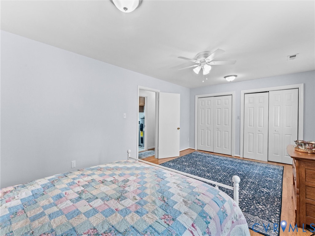 10488 Old Telegraph Road Ashland, VA 23005 - Photo 54 of 69 a bedroom with a bed and a chandelier fan