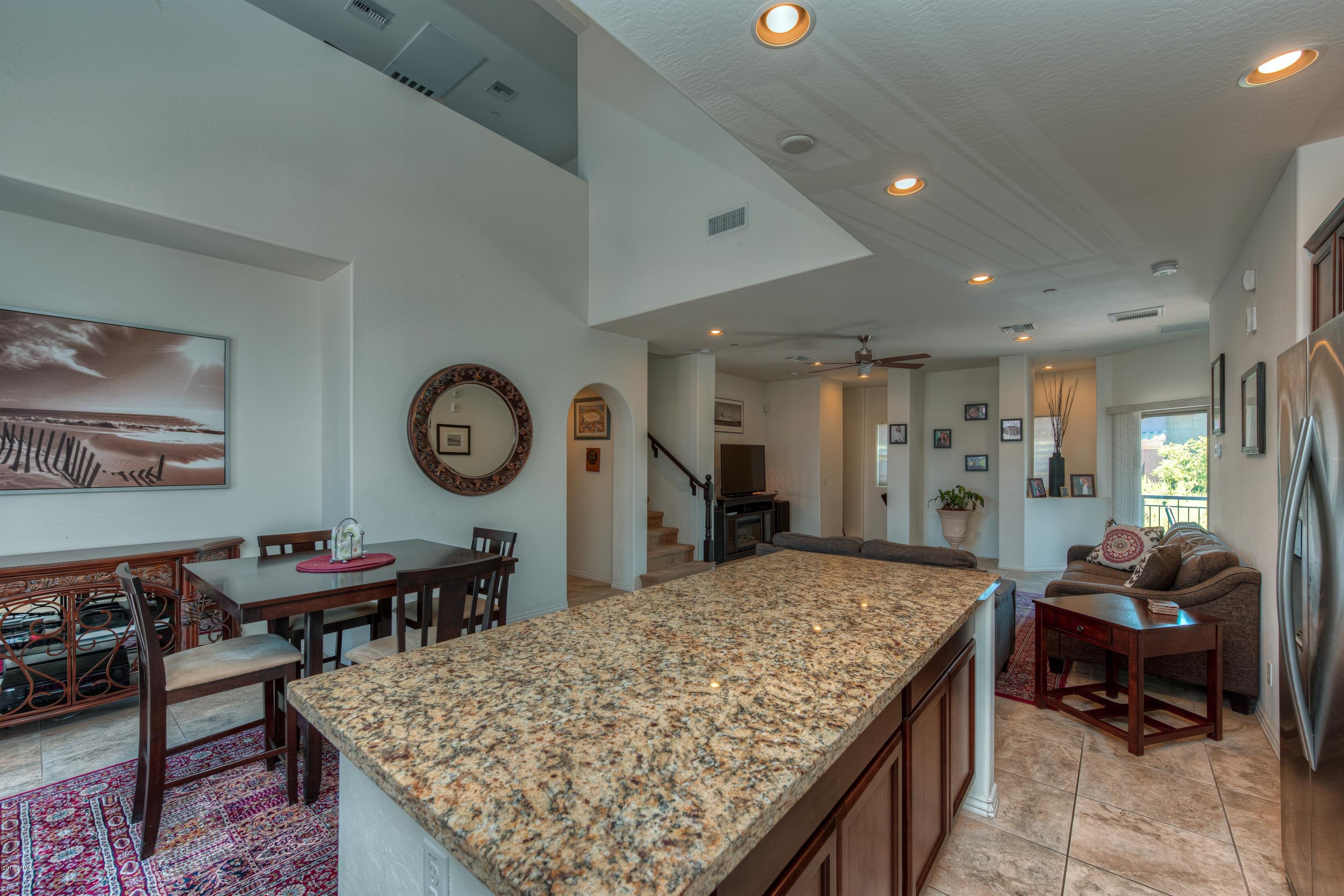 3935 East Rough Rider Road, Unit 1257 Phoenix, AZ 85050 - Photo 5 of 21 012_Kitchen and Living Room