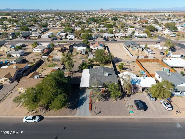 an aerial view of residential houses with outdoor space