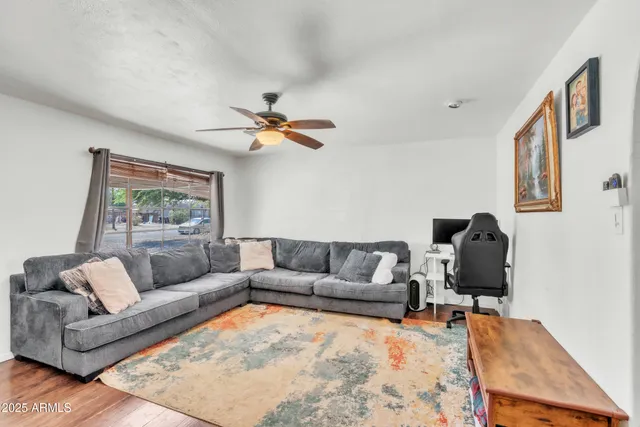 a living room with furniture and a rug