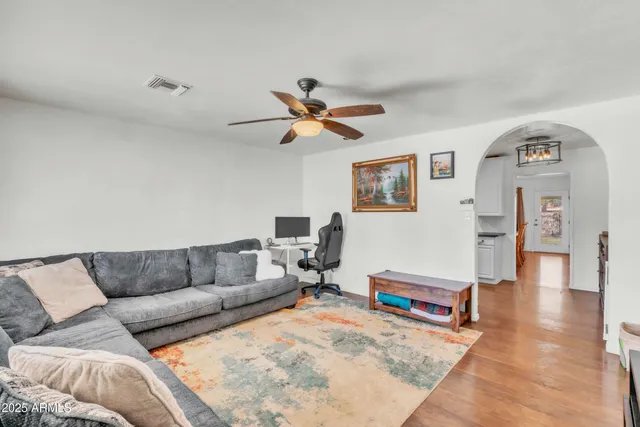 a living room with furniture and a rug