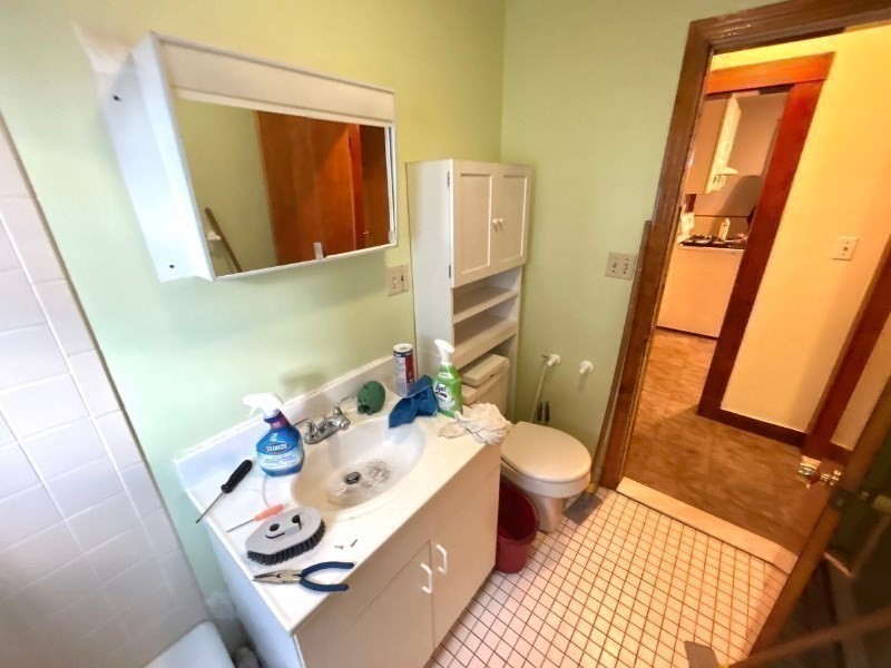 119 Bailey Road, Unit 1 Somerville, MA 02145 - Photo 19 of 25 a bathroom with a sink and a toilet