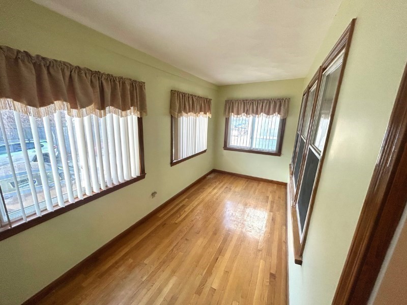119 Bailey Road, Unit 1 Somerville, MA 02145 - Photo 21 of 25 a view of hallway with stairs and wooden floor