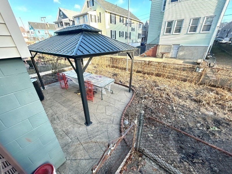 119 Bailey Road, Unit 1 Somerville, MA 02145 - Photo 25 of 25 a view of a backyard with a sitting area and furniture