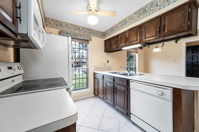 a kitchen with stainless steel appliances granite countertop a stove and cabinets