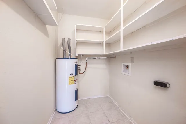 a view of a storage & utility room with racks on the wall