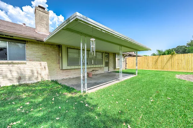 a view of a room with a backyard