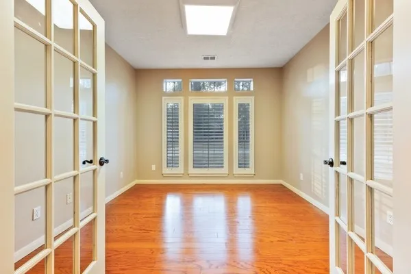 a view of an empty room with a window