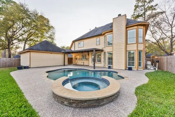 a front view of house with outdoor seating yard and barbeque oven