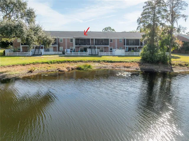 a view of a swimming pool with lounge chairs