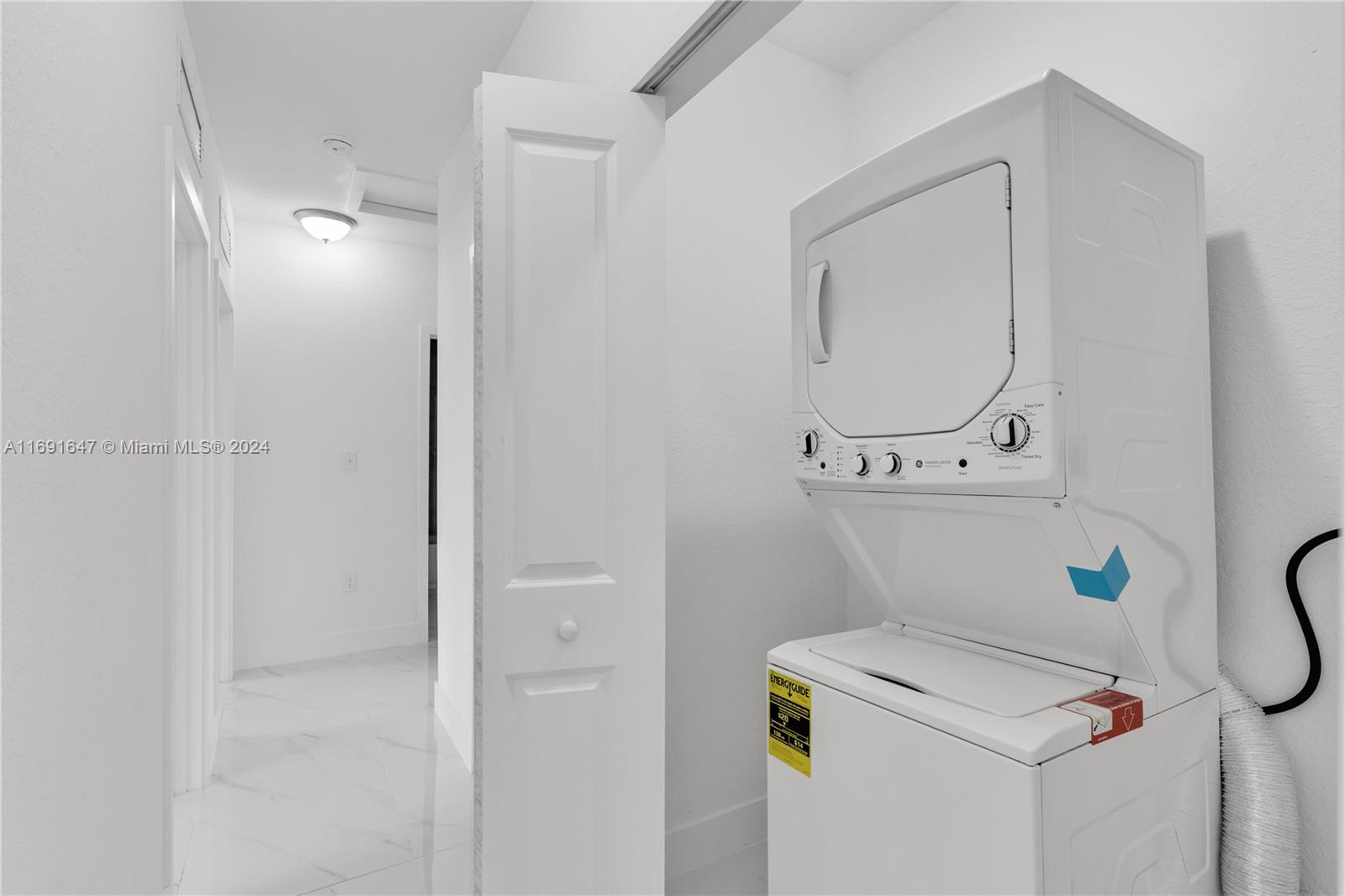 11970 Southwest 213th Street, Unit 1 Miami, FL 33177 - Photo 11 of 36 a utility room with dryer and washer