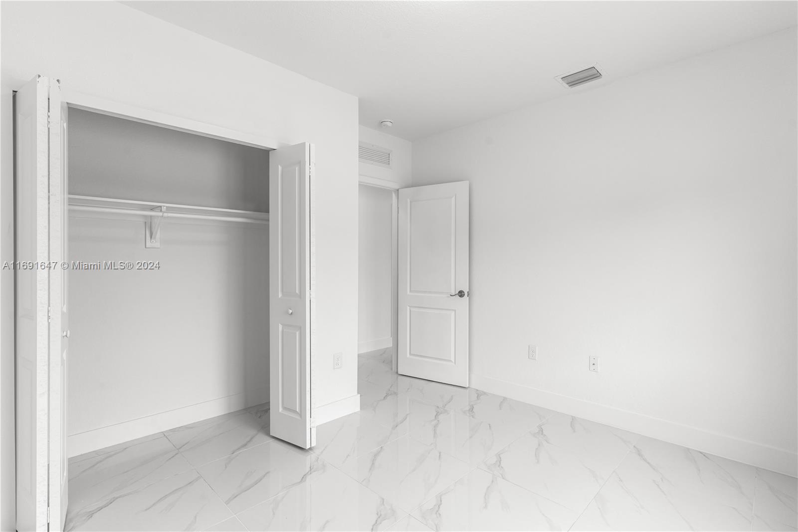 11970 Southwest 213th Street, Unit 1 Miami, FL 33177 - Photo 13 of 36 a view of an empty room