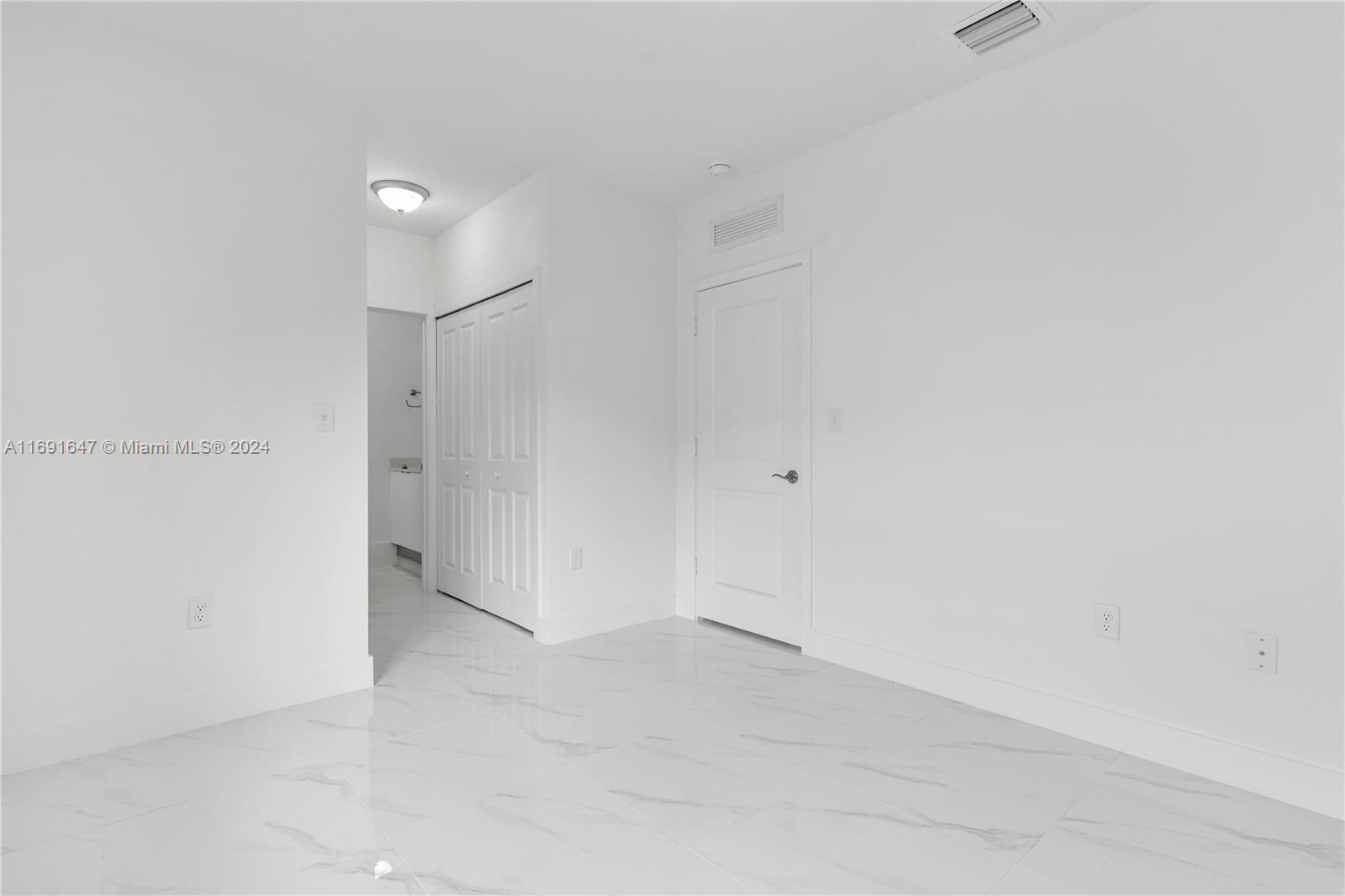 11970 Southwest 213th Street, Unit 1 Miami, FL 33177 - Photo 17 of 36 a view of an empty room