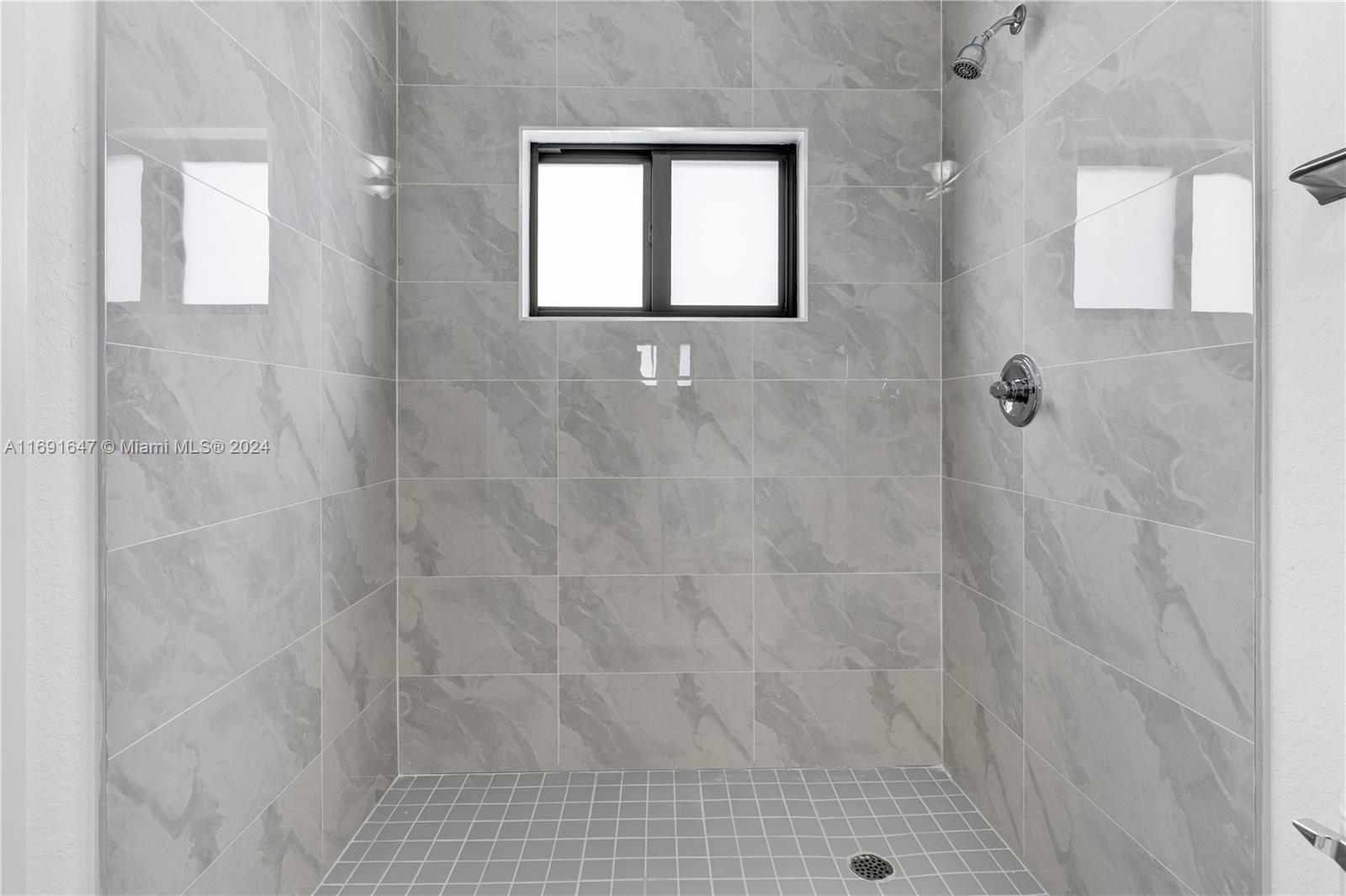 11970 Southwest 213th Street, Unit 1 Miami, FL 33177 - Photo 20 of 36 a bathroom with a shower