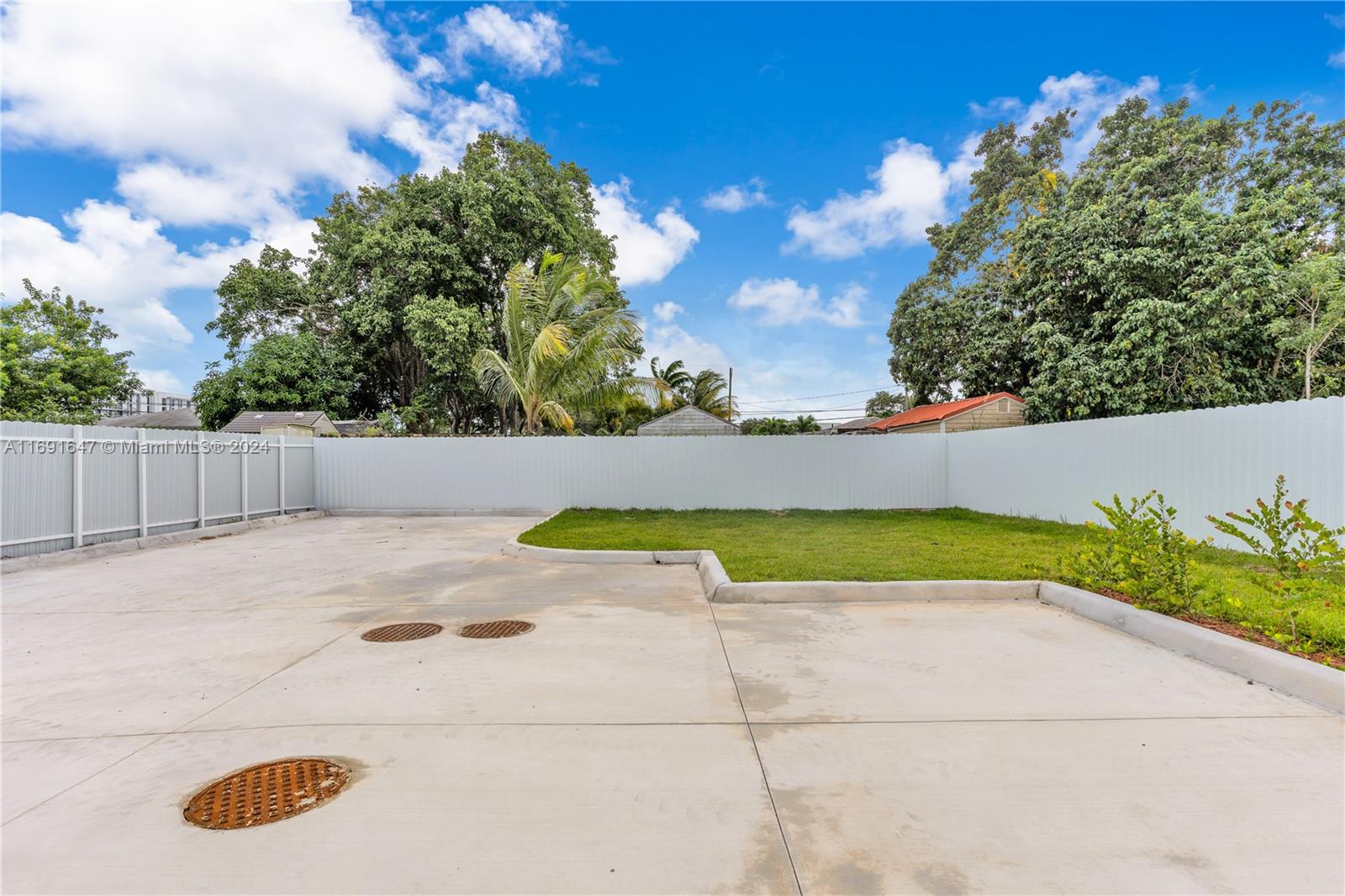 11970 Southwest 213th Street, Unit 1 Miami, FL 33177 - Photo 25 of 36 view of outdoor space yard and entertaining space