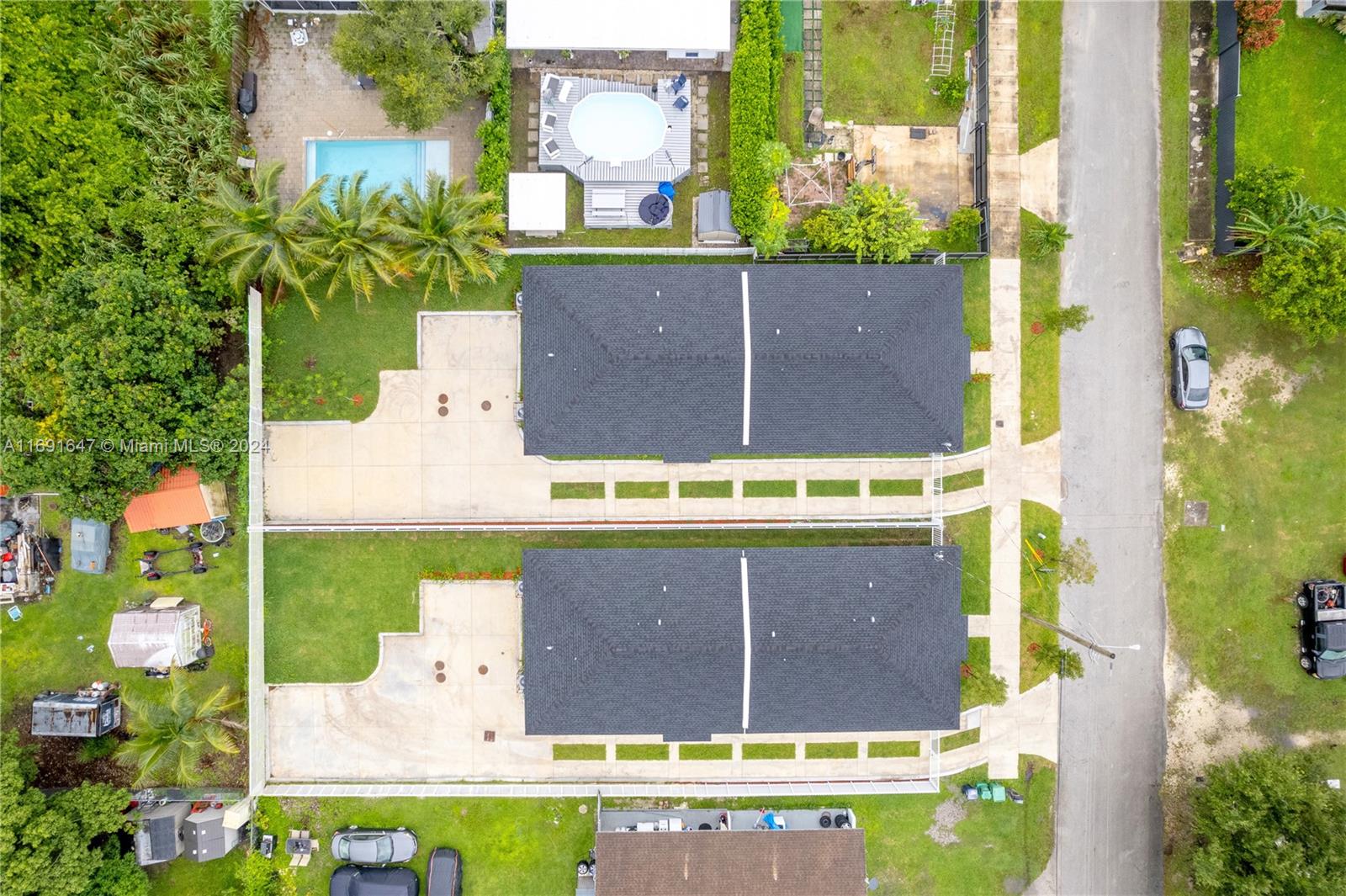 11970 Southwest 213th Street, Unit 1 Miami, FL 33177 - Photo 34 of 36 a view of swimming pool with a yard
