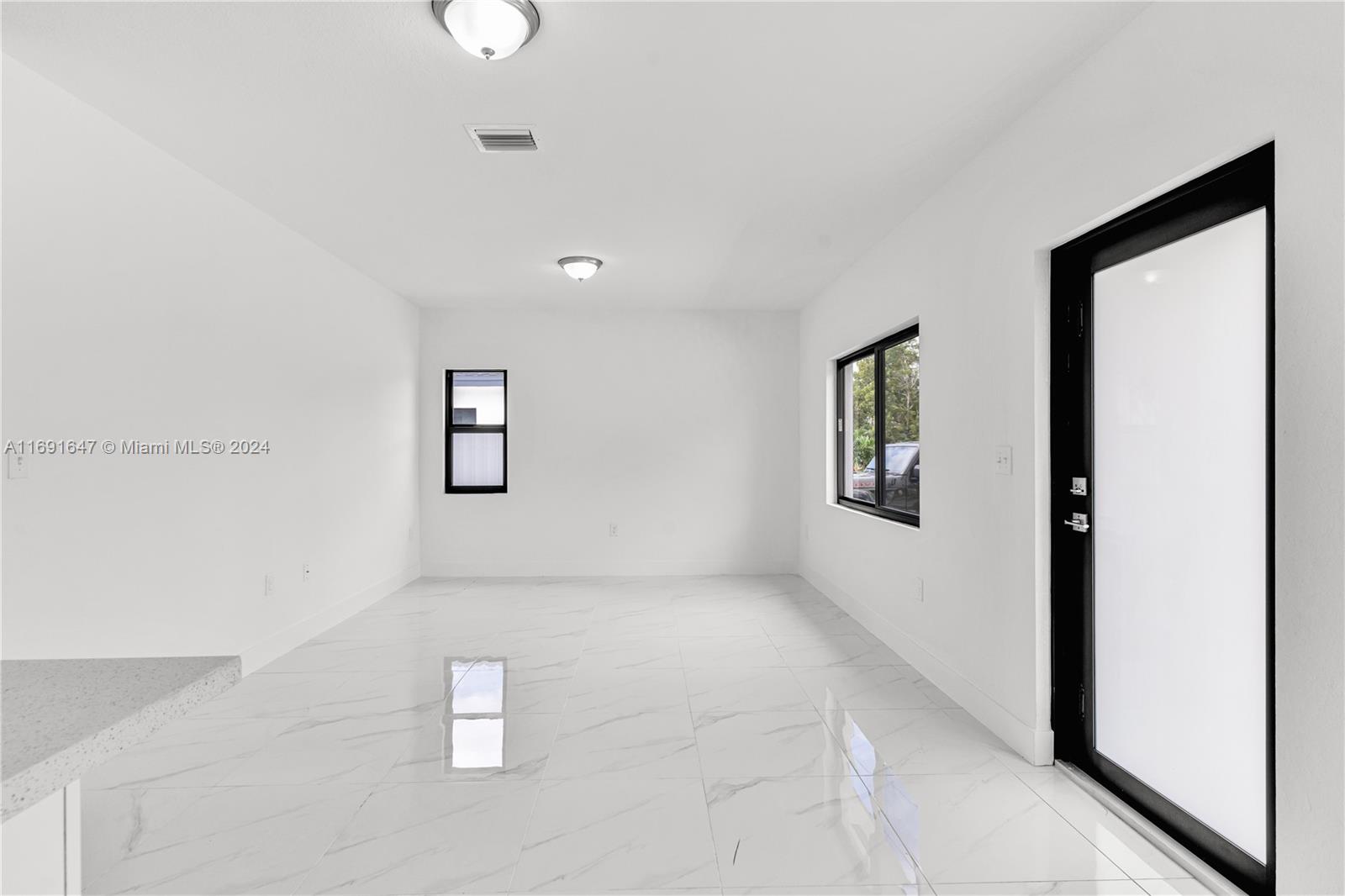 11970 Southwest 213th Street, Unit 1 Miami, FL 33177 - Photo 4 of 36 a view of an empty room