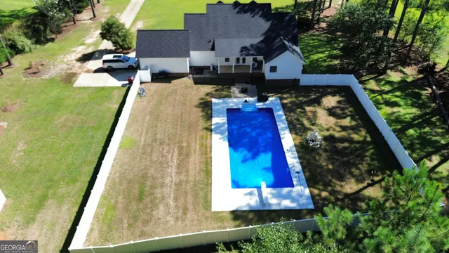 an aerial view of a house with a garden