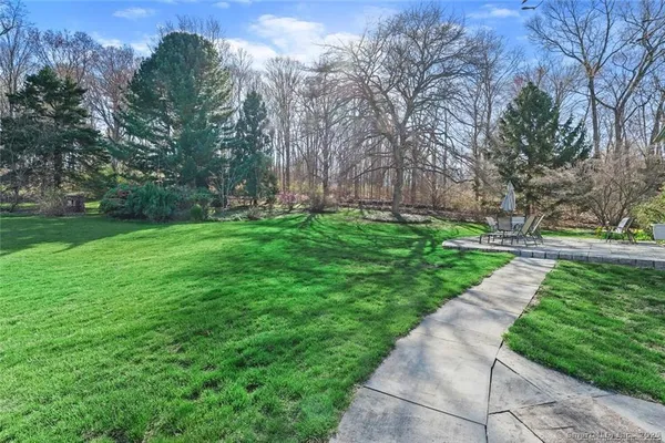 a backyard of a house with lots of green space