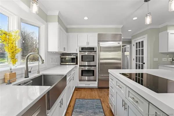 a kitchen with a sink and a refrigerator