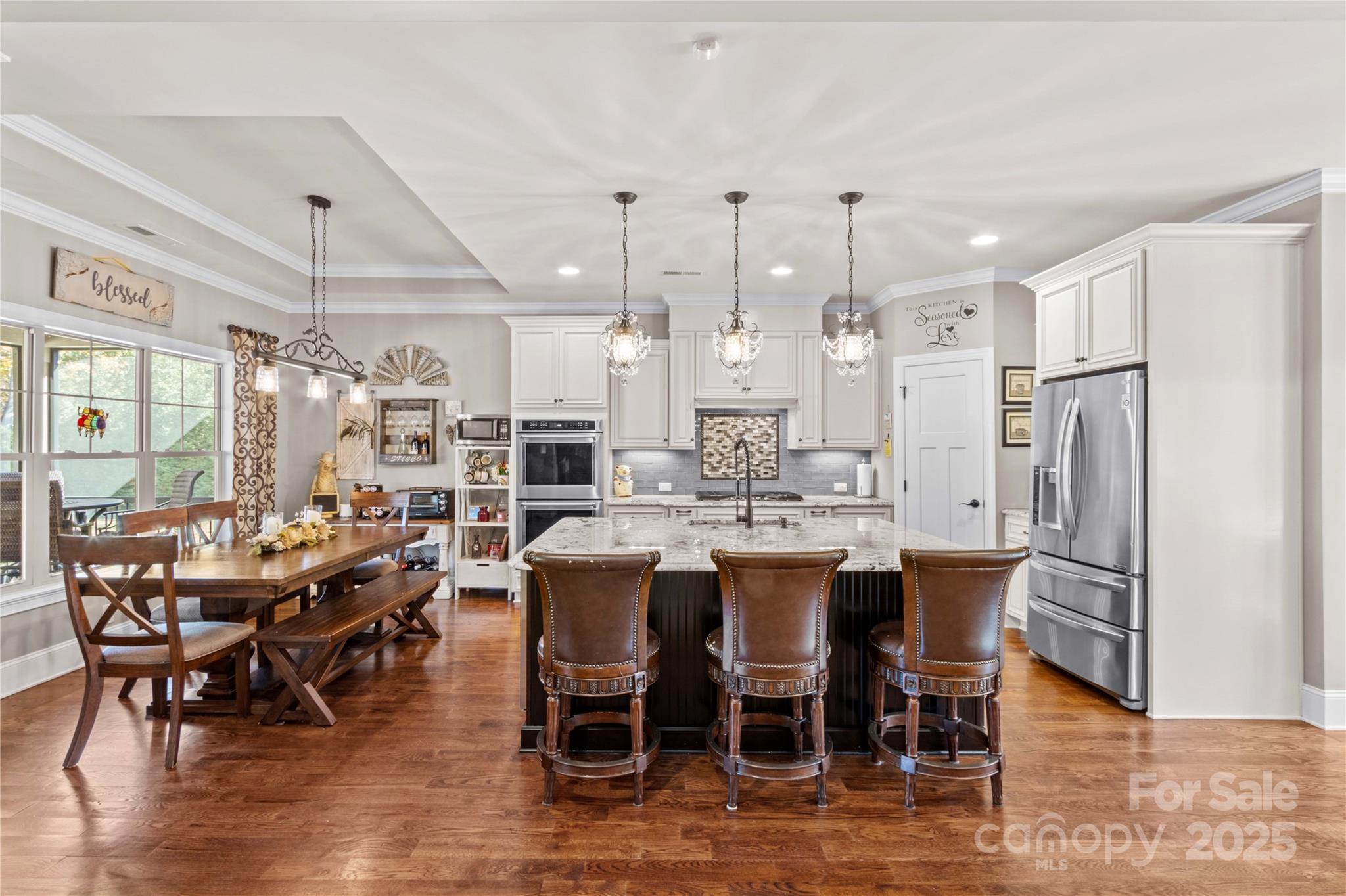 8612 Amandine Way Terrell, NC 28682 - Photo 11 of 48 a large kitchen with a table and chairs