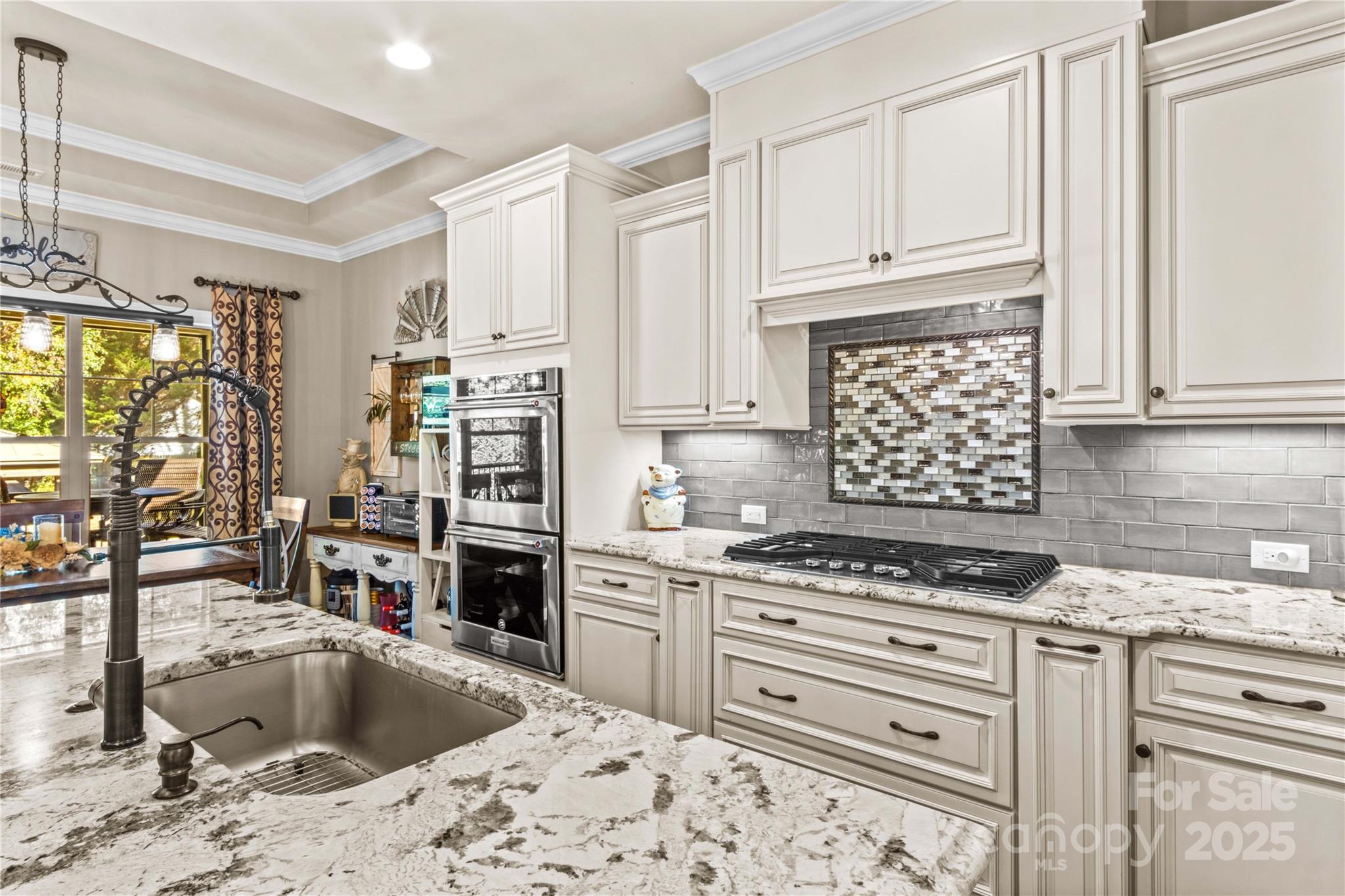 8612 Amandine Way Terrell, NC 28682 - Photo 13 of 48 a kitchen with stainless steel appliances kitchen island granite countertop a sink stove and cabinets