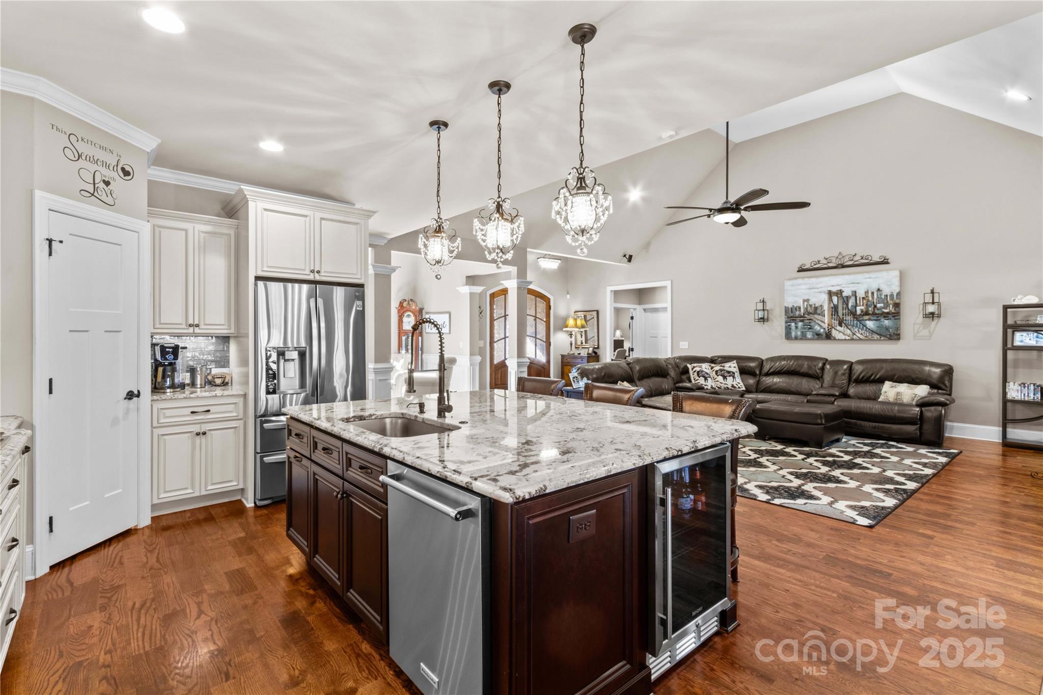 8612 Amandine Way Terrell, NC 28682 - Photo 15 of 48 a kitchen with stainless steel appliances granite countertop stove a refrigerator a sink dishwasher and white cabinets with wooden floor