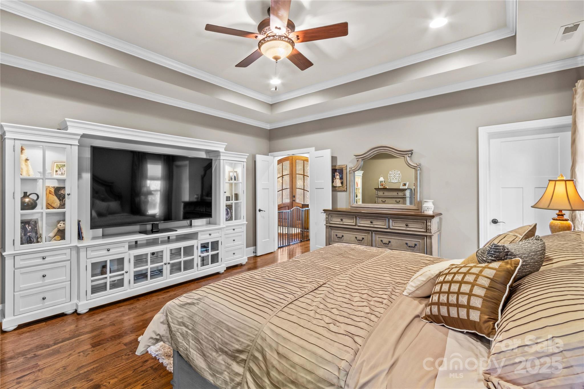 8612 Amandine Way Terrell, NC 28682 - Photo 18 of 48 a bedroom with a bed and a flat screen tv
