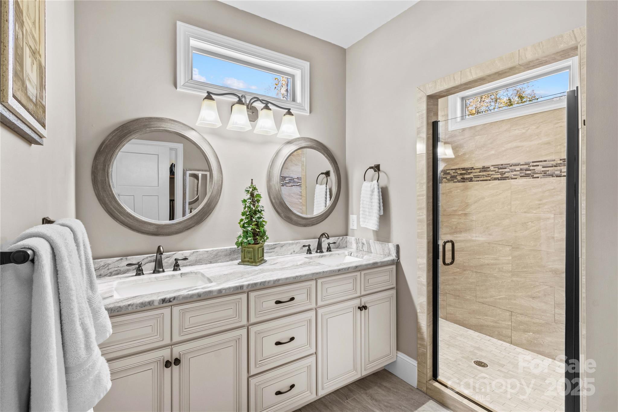 8612 Amandine Way Terrell, NC 28682 - Photo 19 of 48 a bathroom with a double vanity sink and a mirror