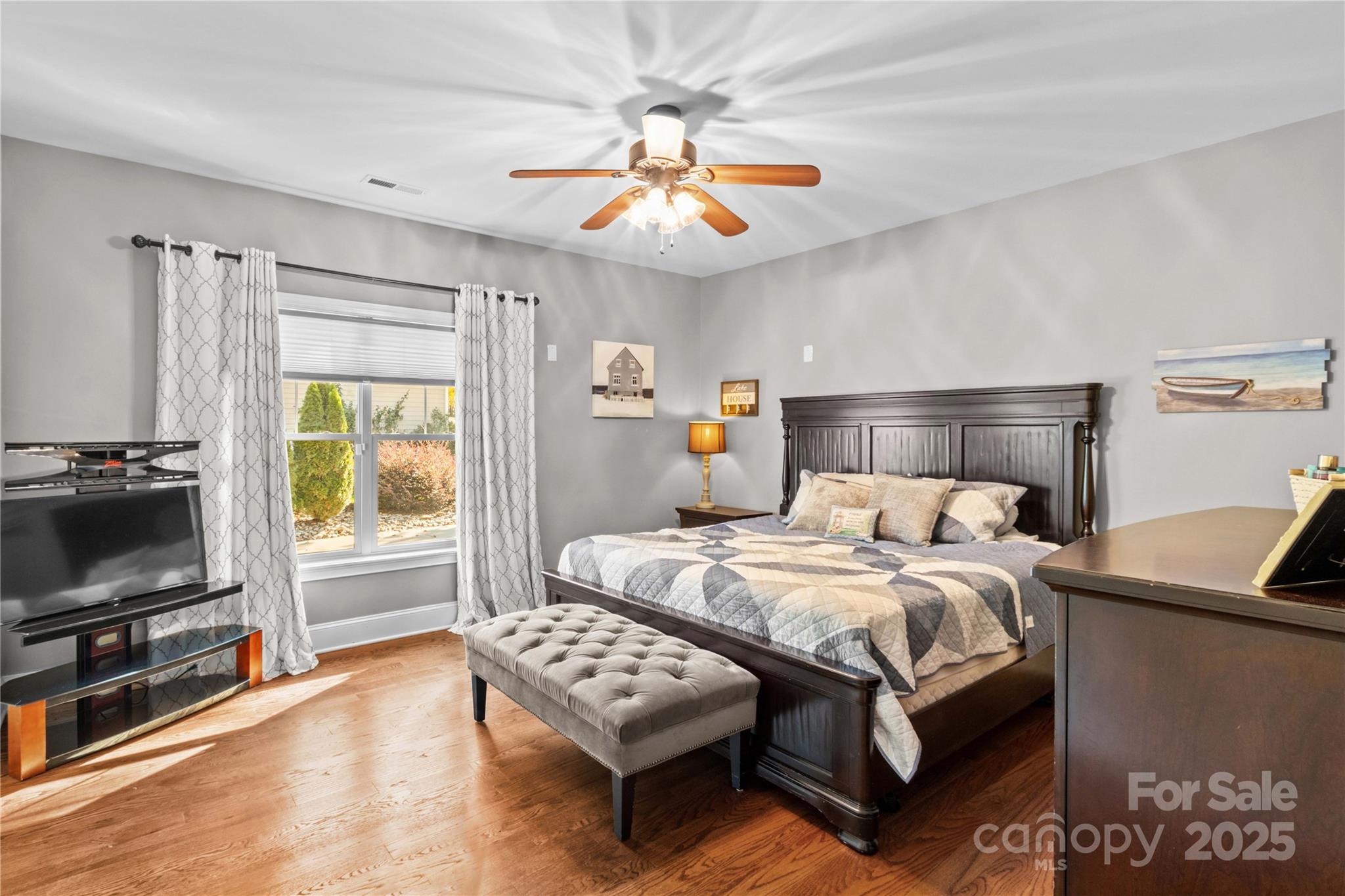 8612 Amandine Way Terrell, NC 28682 - Photo 22 of 48 a bedroom with bed table and flat screen tv