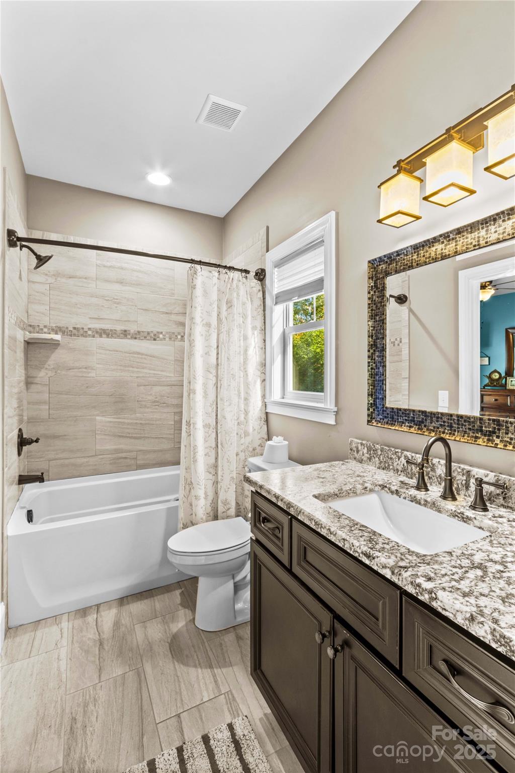 8612 Amandine Way Terrell, NC 28682 - Photo 23 of 48 a bathroom with a granite countertop sink toilet and shower