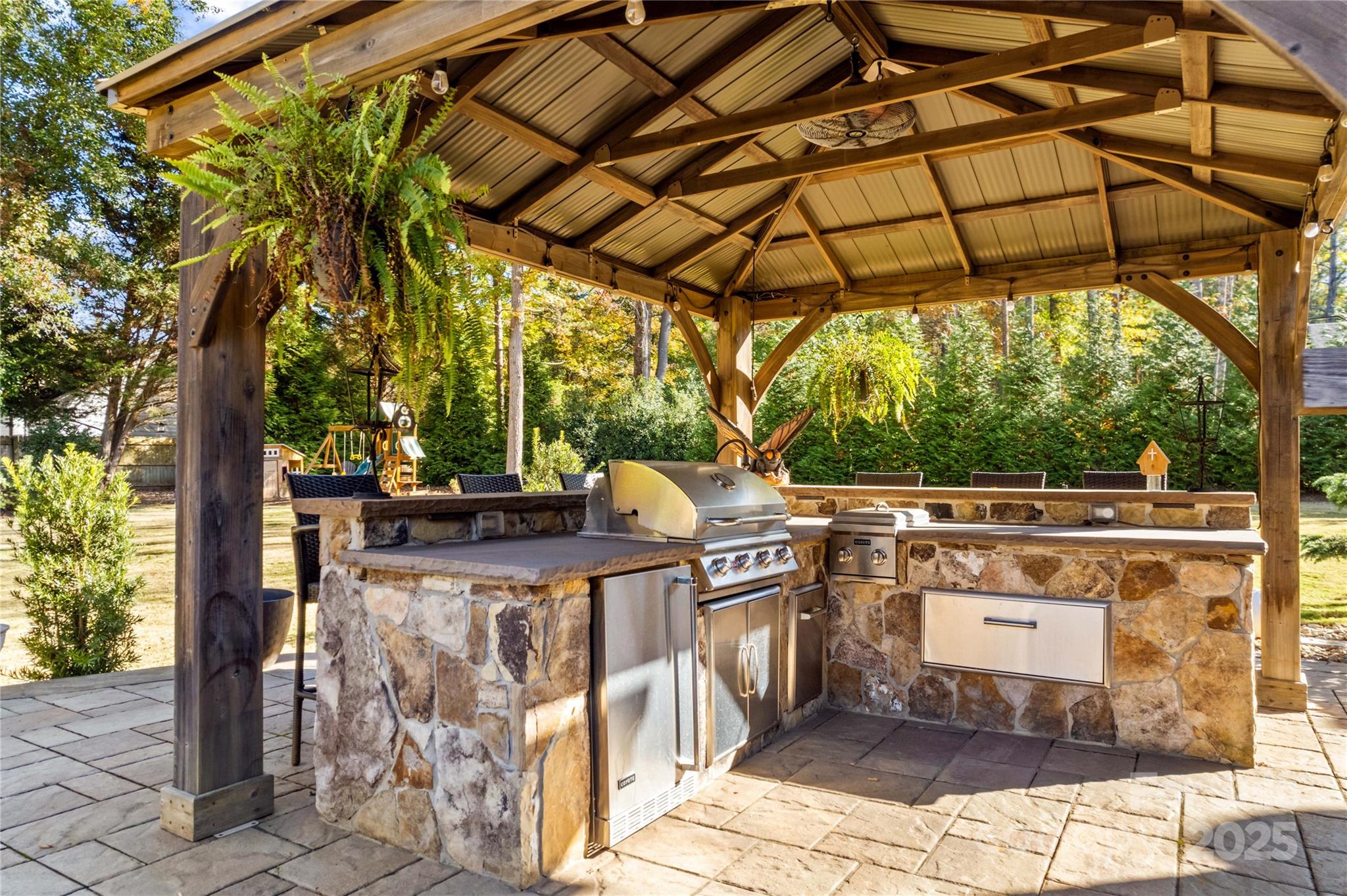 8612 Amandine Way Terrell, NC 28682 - Photo 39 of 48 a view of a patio with table and chairs under an umbrella