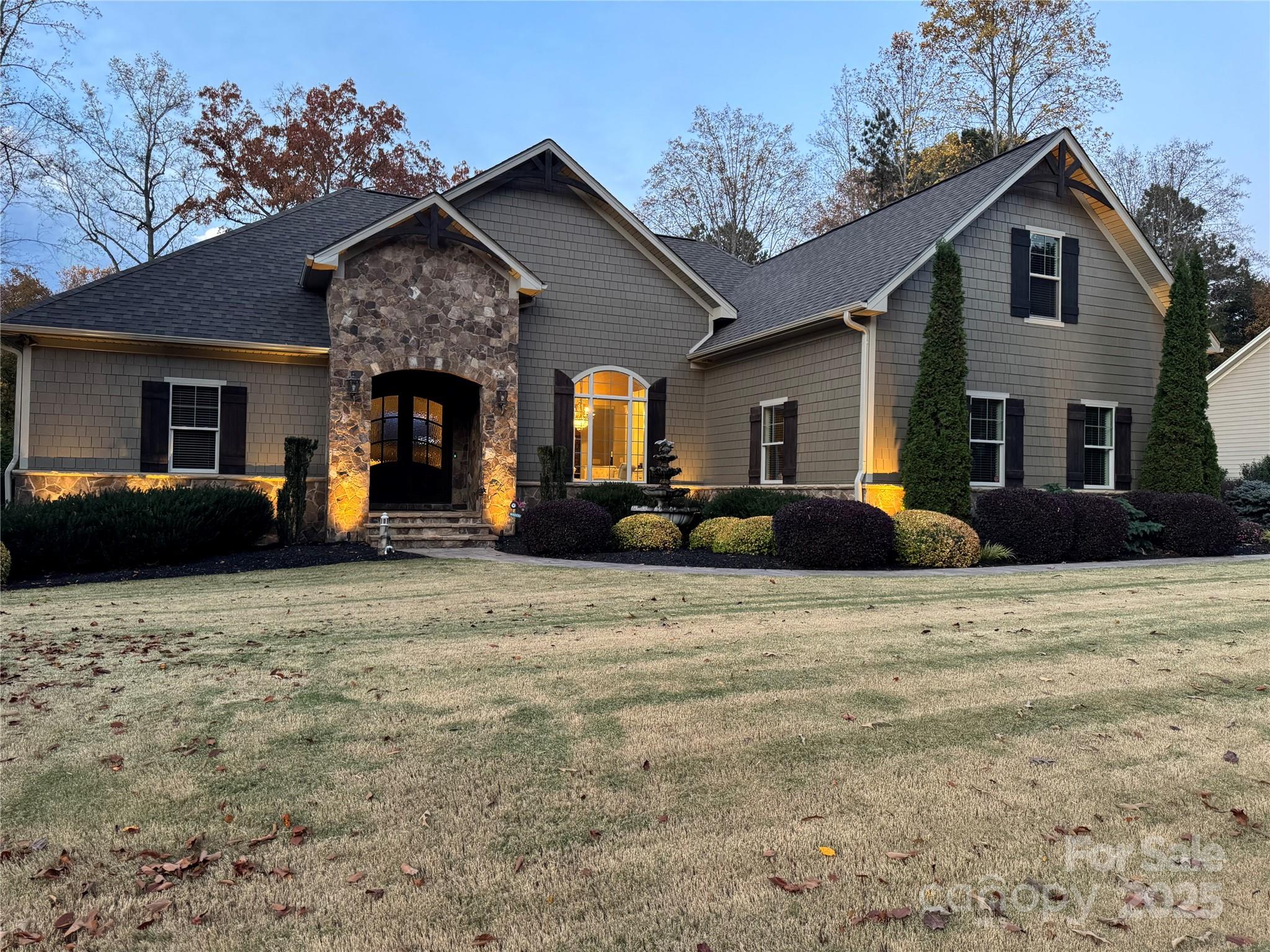 8612 Amandine Way Terrell, NC 28682 - Photo 46 of 48 a front view of a house with lots of trees and livingroom