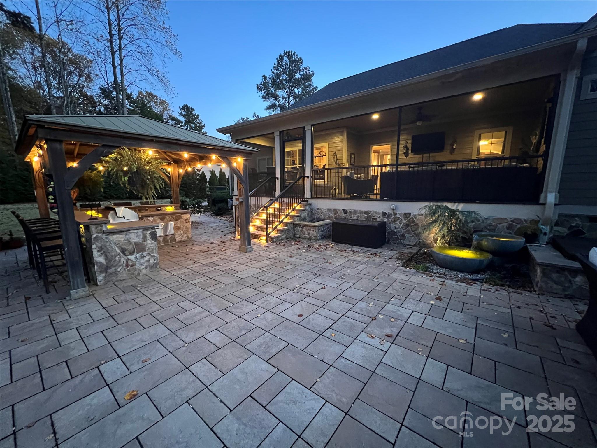8612 Amandine Way Terrell, NC 28682 - Photo 47 of 48 a view of a patio with table and chairs and potted plants