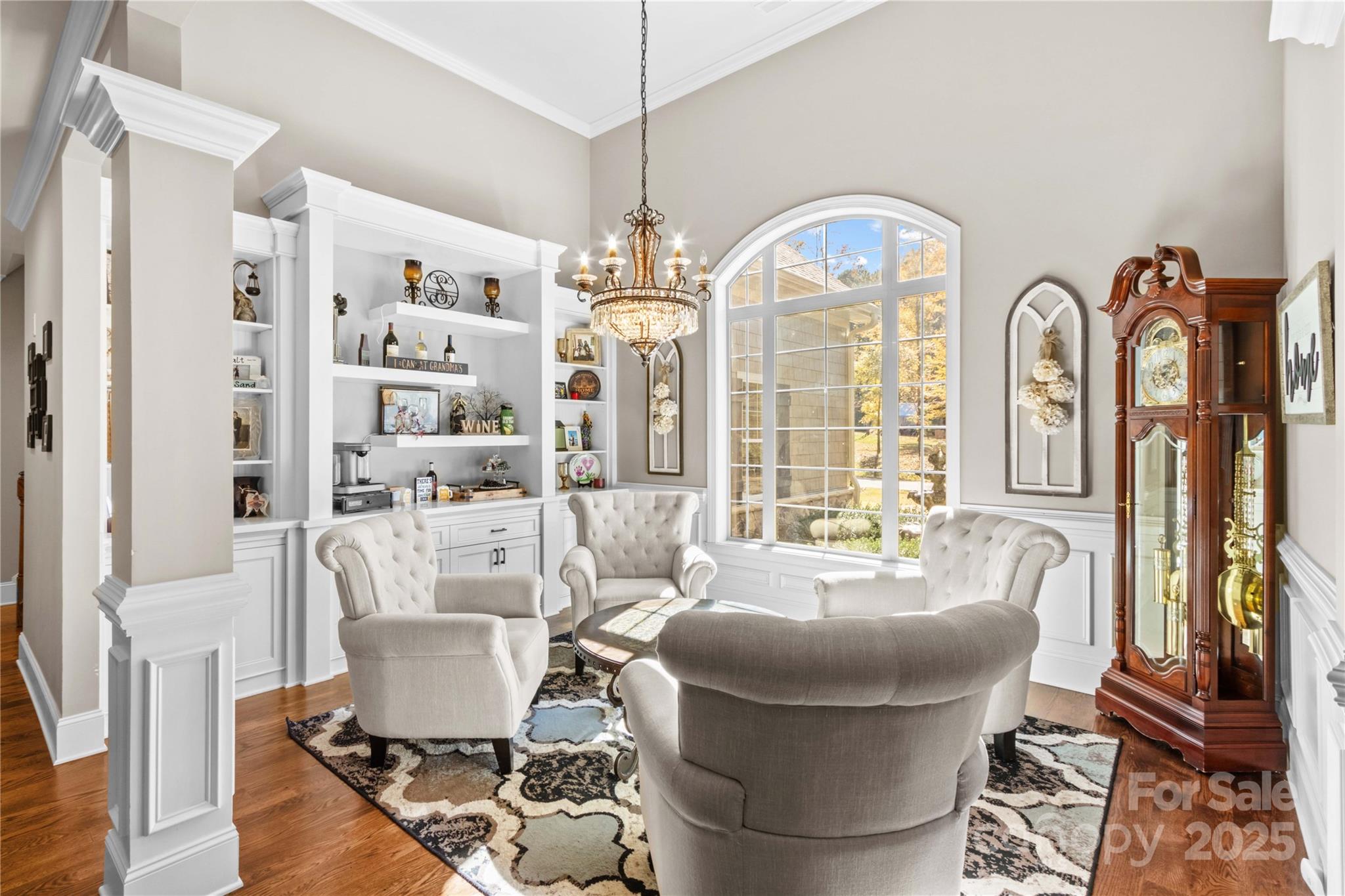 8612 Amandine Way Terrell, NC 28682 - Photo 7 of 48 a living room with furniture a fireplace and large windows