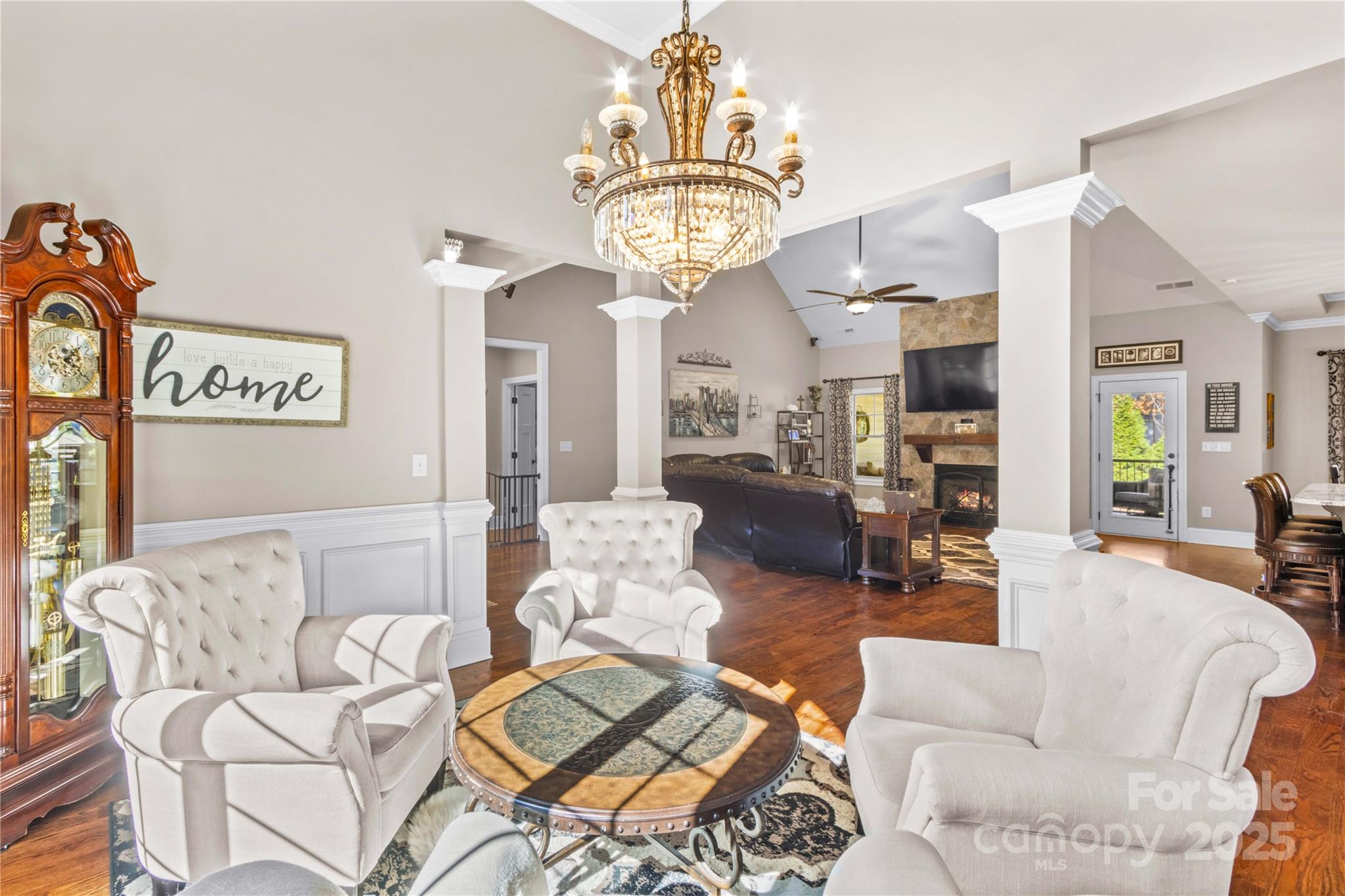 8612 Amandine Way Terrell, NC 28682 - Photo 8 of 48 a living room with furniture a clock and a chandelier