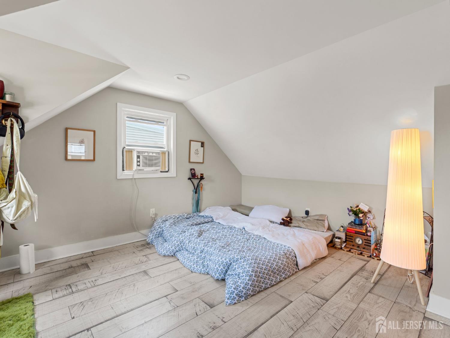 19 Wolf Drive Hamilton, NJ 08610 - Photo 12 of 24 a bedroom with a bed and a window