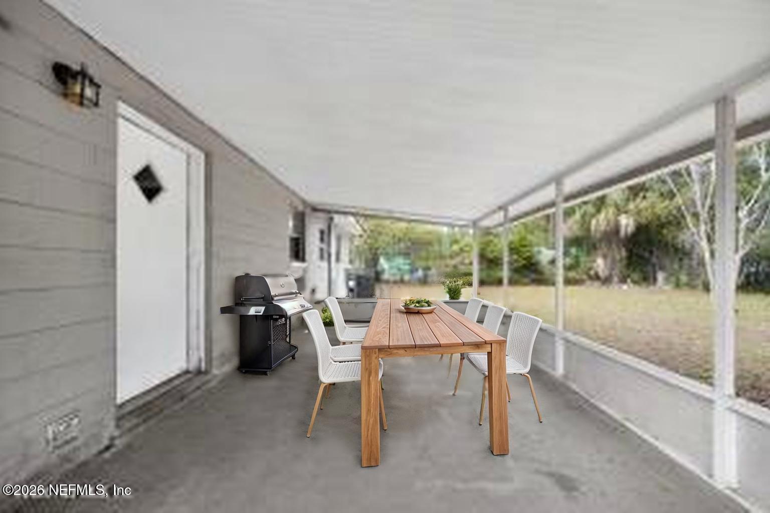 8609 Oak Leaf Road Jacksonville, FL 32208 - Photo 14 of 18 a living room with furniture and a large window