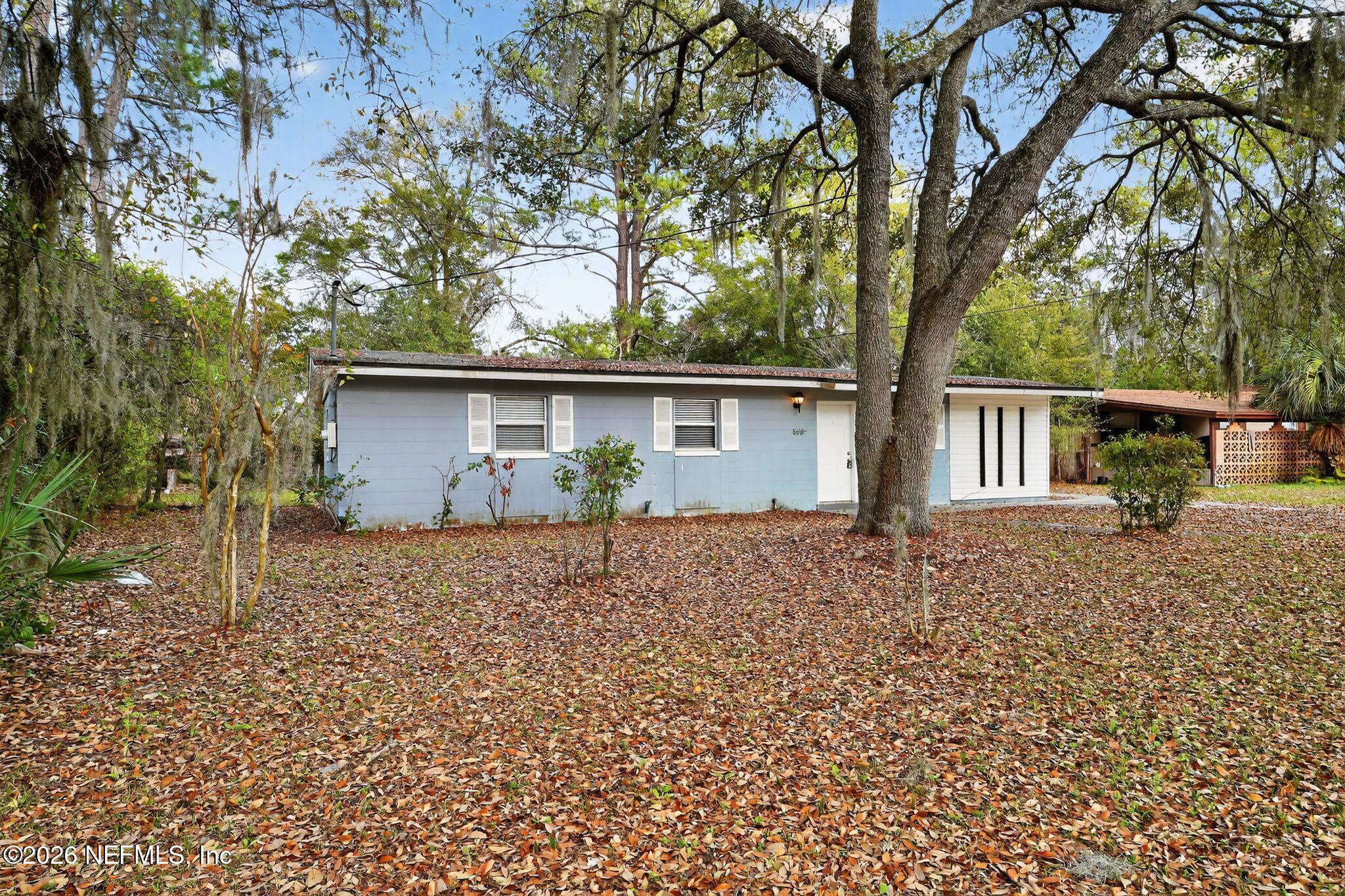 8609 Oak Leaf Road Jacksonville, FL 32208 - Photo 17 of 18 a view of a house with a tree