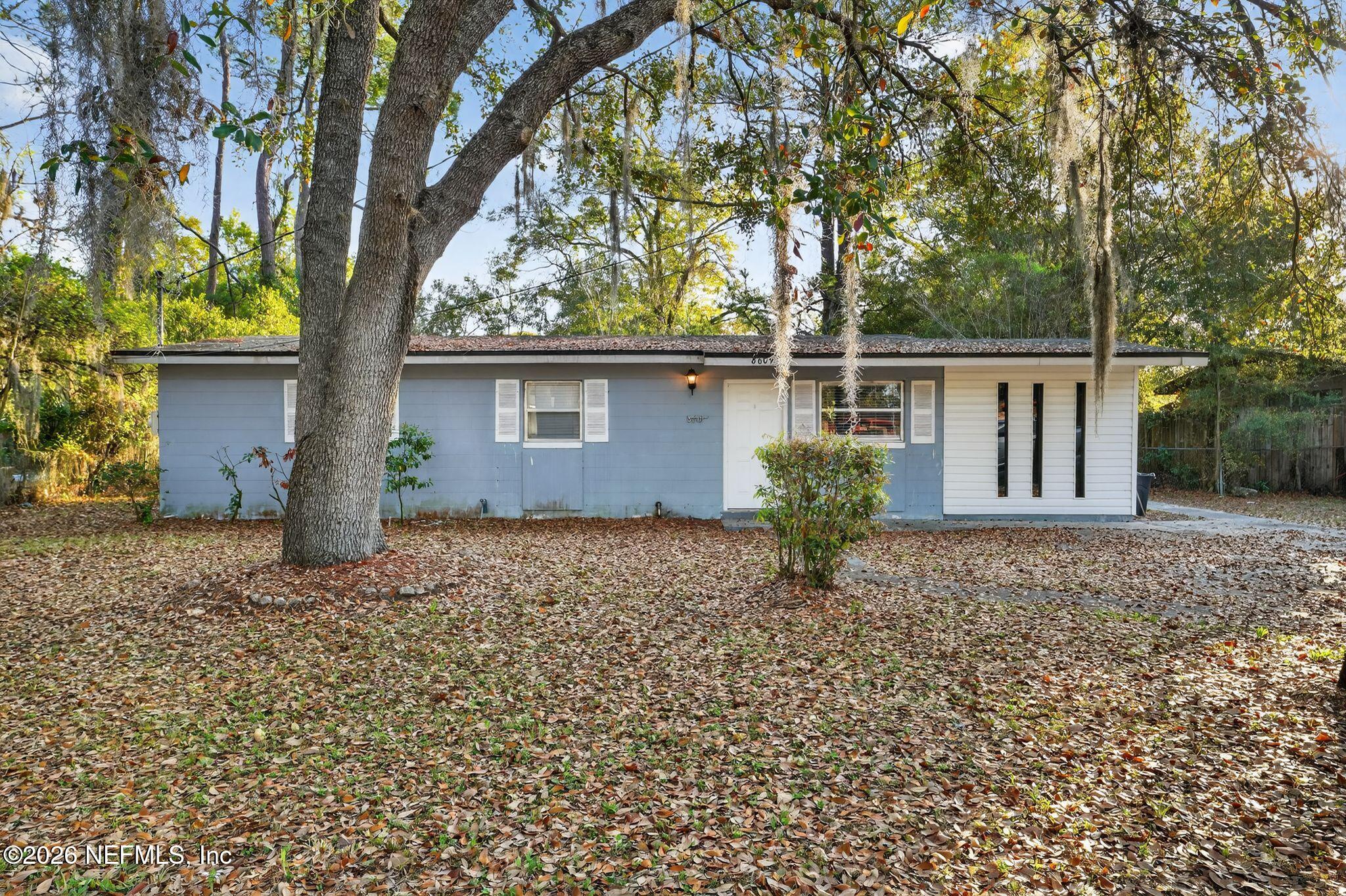 8609 Oak Leaf Road Jacksonville, FL 32208 - Photo 18 of 18 a house with trees in front of it