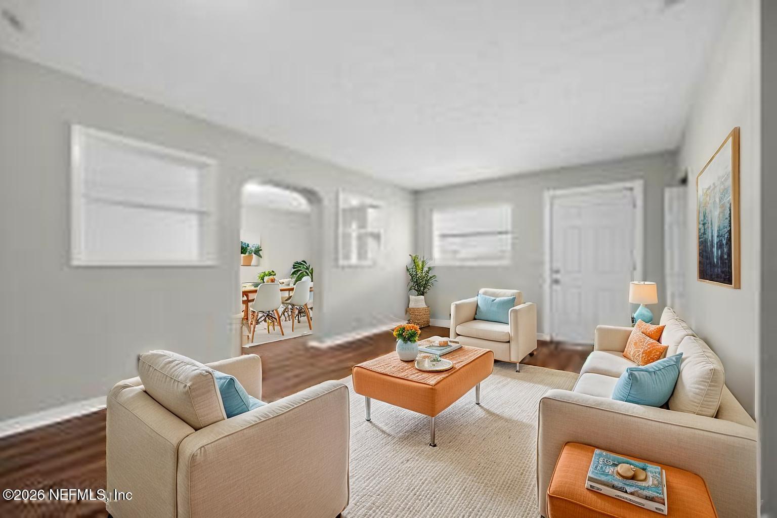 8609 Oak Leaf Road Jacksonville, FL 32208 - Photo 5 of 18 a living room with furniture and wooden floor