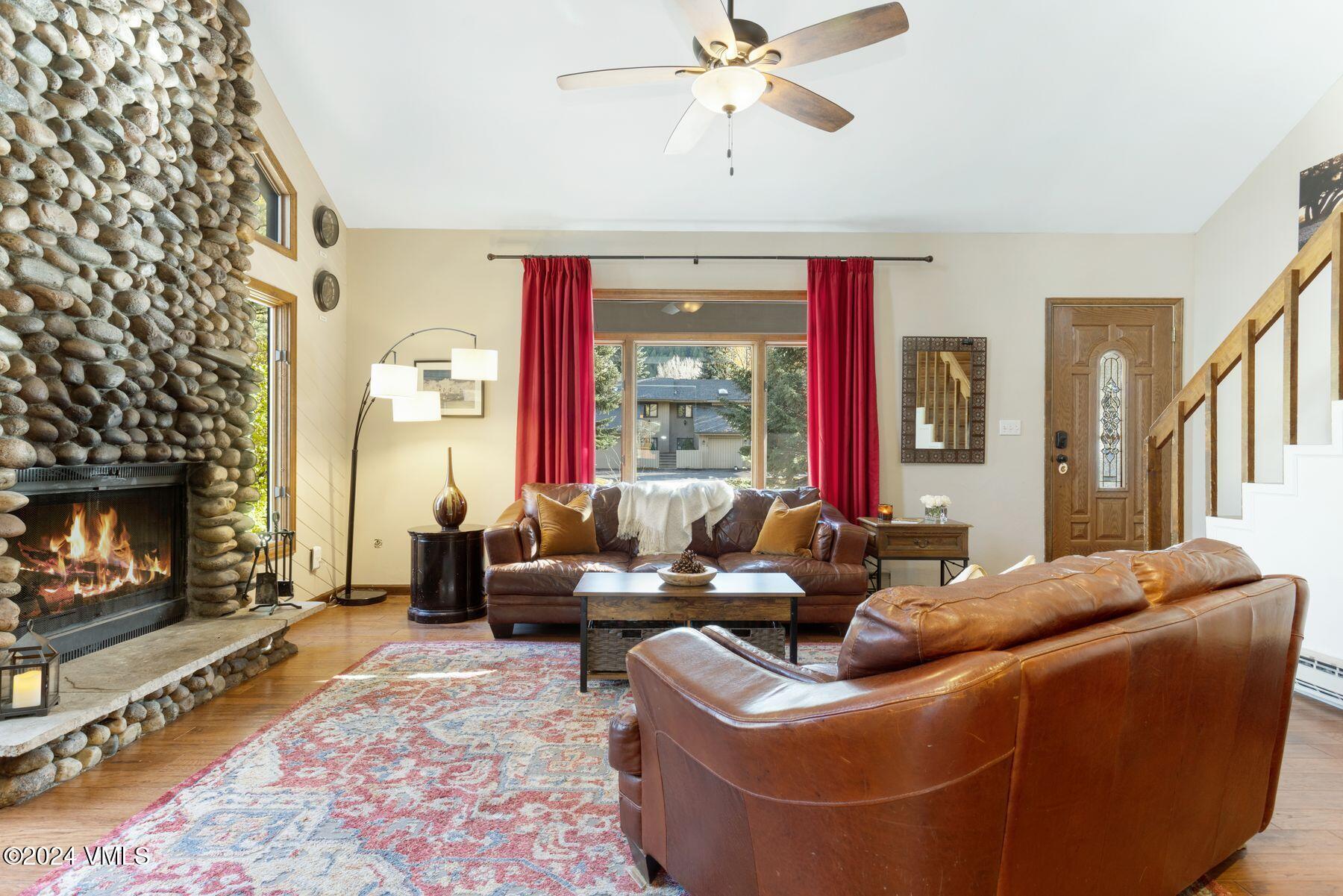149 Deer Boulevard, Unit A Eagle-Vail, CO 81620 - Photo 11 of 22 a living room with furniture and a fireplace