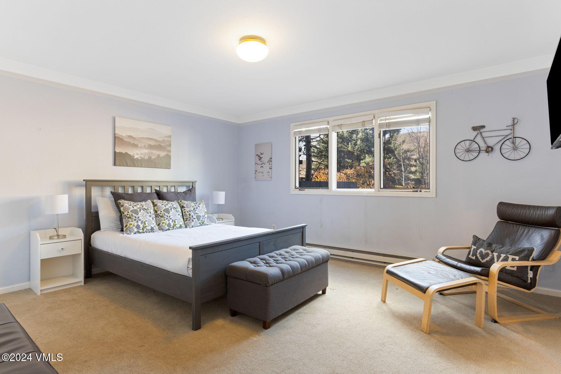 149 Deer Boulevard, Unit A Eagle-Vail, CO 81620 - Photo 12 of 22 a bedroom with a bed and a window