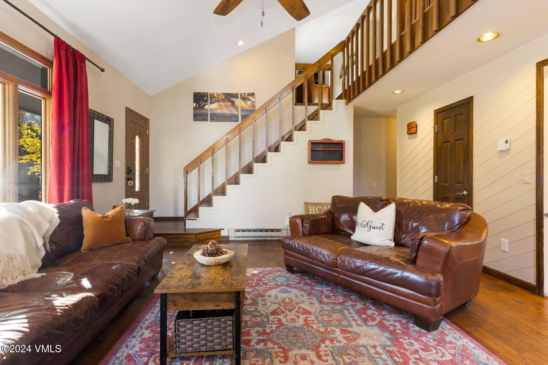 149 Deer Boulevard, Unit A Eagle-Vail, CO 81620 - Photo 13 of 22 a living room with furniture and a rug