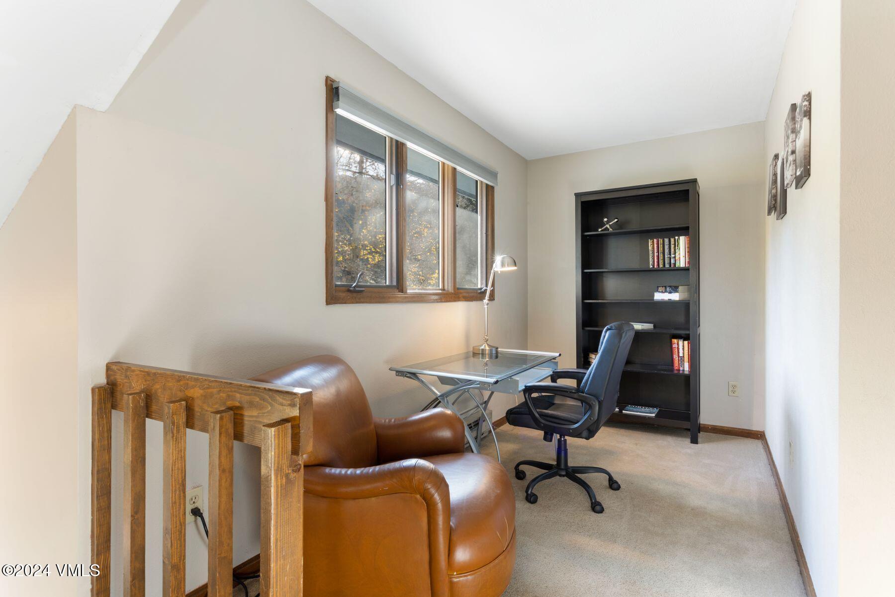 149 Deer Boulevard, Unit A Eagle-Vail, CO 81620 - Photo 14 of 22 a view of a workspace with furniture and a window
