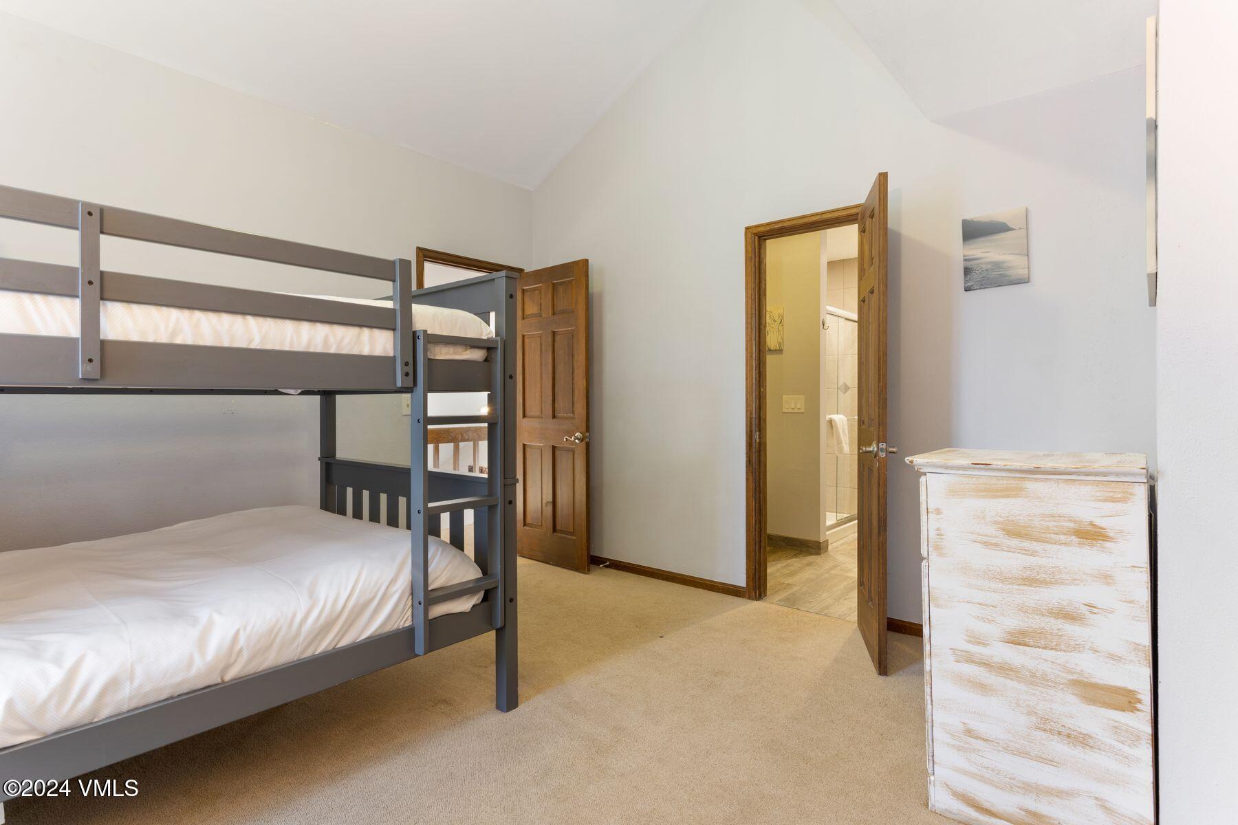 149 Deer Boulevard, Unit A Eagle-Vail, CO 81620 - Photo 20 of 22 a bedroom with a bed and a window