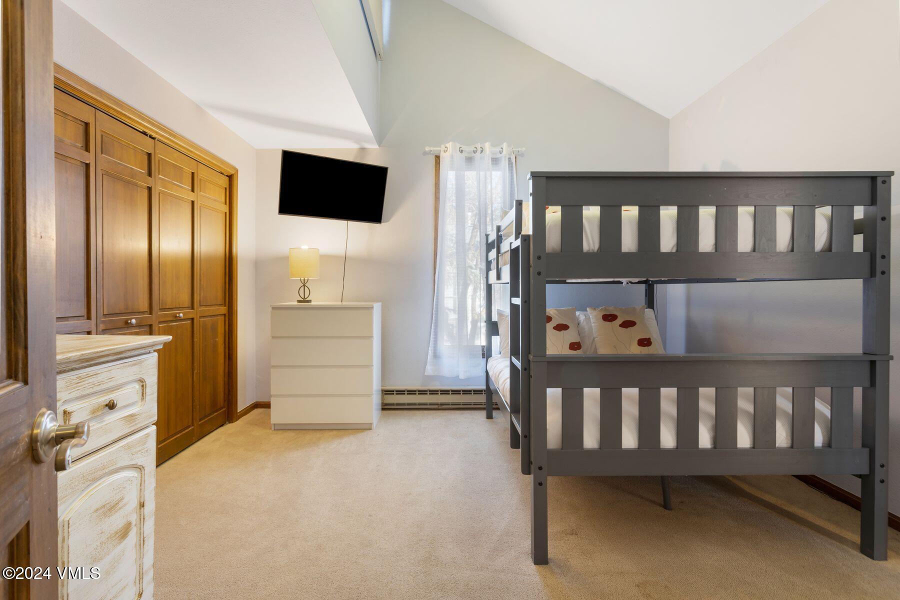149 Deer Boulevard, Unit A Eagle-Vail, CO 81620 - Photo 21 of 22 a view of a bedroom with furniture