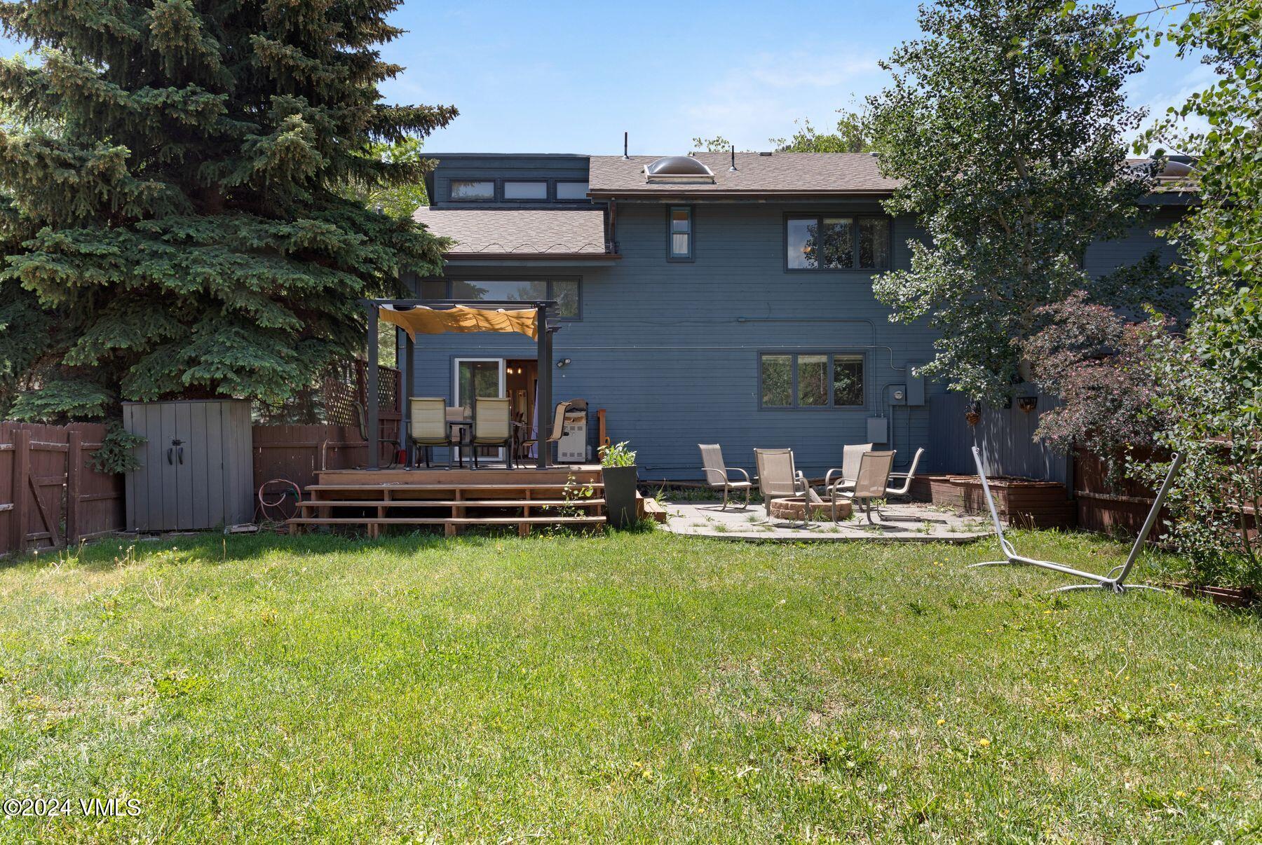 149 Deer Boulevard, Unit A Eagle-Vail, CO 81620 - Photo 22 of 22 a view of a house with swimming pool and sitting area
